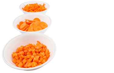 Fototapeta na wymiar Different style of chopped carrots in white bowls