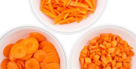 Different style of chopped carrots in white bowls