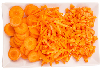 Different style of chopped carrots in a plate 