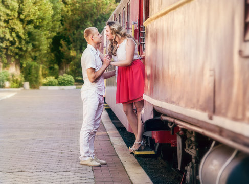 Love couple farewell moment on the retro railway Station
