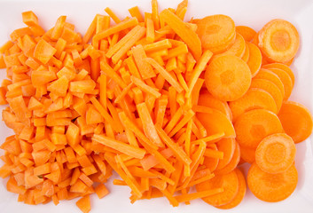 Different style of chopped carrots in a plate 