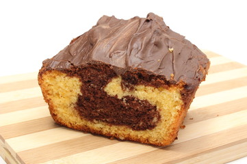 Chocolate cake on wooden cutting board