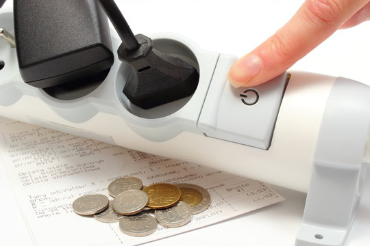 Power strip and electricity bill with coins