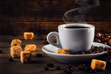 Coffee espresso with cane sugar and coffee beans.