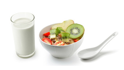 fresh milk in the glass and muesli breakfast placed on white bac