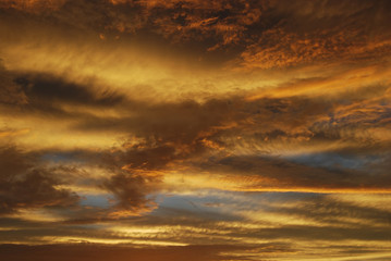 Naklejka na ściany i meble Evening sky sunset, yellow clouds.