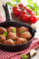 meatballs with tomato sauce in black pan