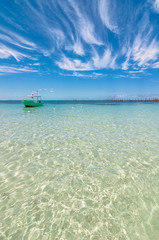Obraz premium tropical sea and boat in Isla Mujeres, Mexico