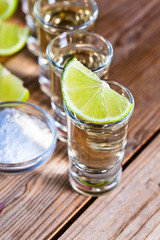 gold tequila with salt and lime