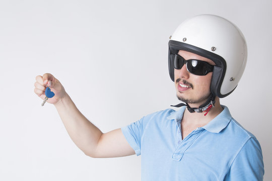 A Men Holding A Motorcycle Keys