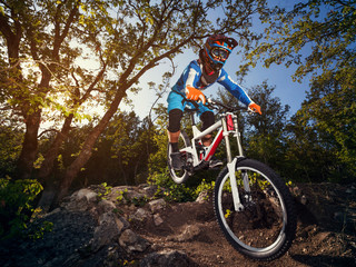 Fototapeta na wymiar Cyclist riding a mountain bike downhill style.