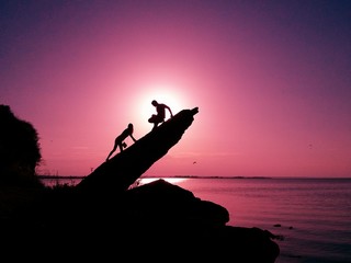 People's silhouette on the stones