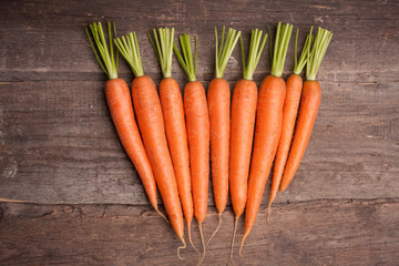 fresh carrot bunch on grungy wooden background