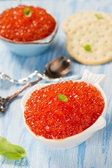 Red caviar in fish-shape bowl