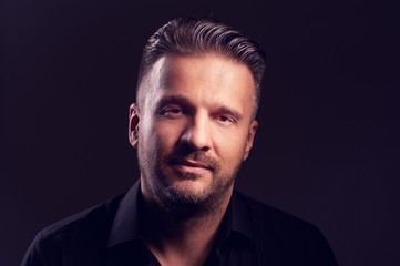 Handsome male looking at the camera and smiling