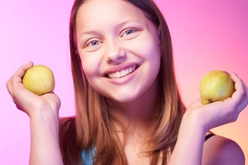 Beautiful  teen girl with apples in her hands