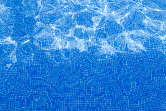 Reflections on the water of a swimming pool