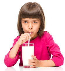 Cute little girl with a glass of milk