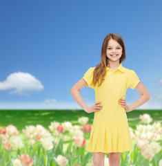 smiling little girl in yellow dress