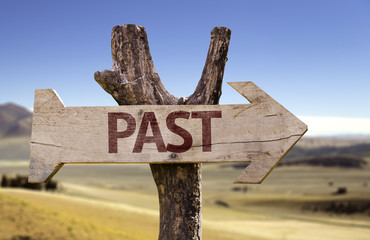 Past wooden sign with a desert background