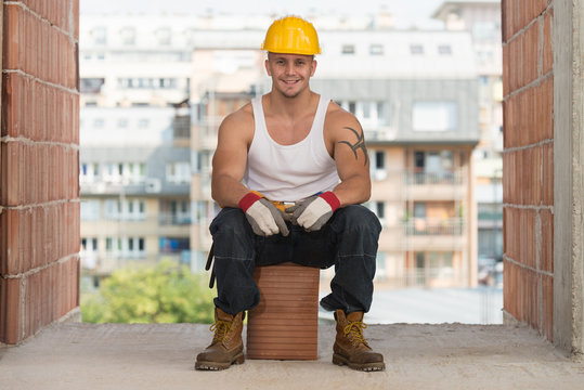 Worker Is Resting Sitting On Brick