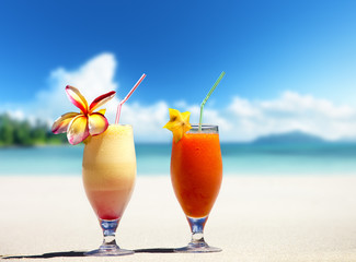 fresh fruit juices on a tropical beach