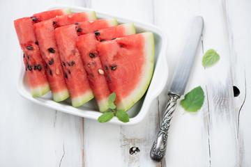 Sliced watermelon with fresh mint, studio shot, high angle view