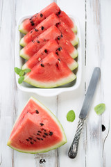 Sliced watermelon with fresh mint, high angle view