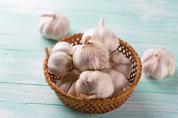 Garlic on wooden background.