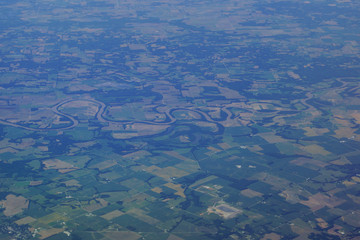aerial photograph of rural middle USA with river running though