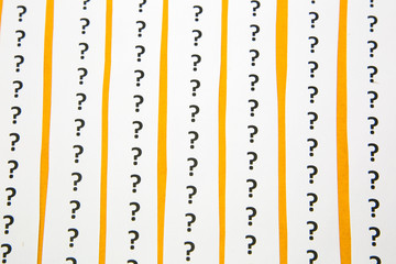 A background of question mark signs and symbols