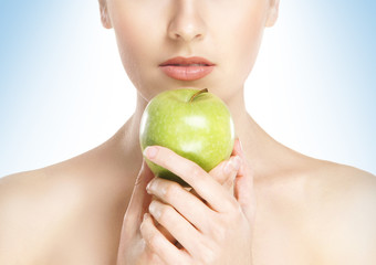 Portrait of beautiful, healthy and sensual girl eating an apple