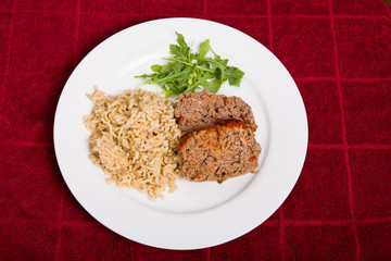 Meatloaf Rice and Arugula on Red Towel