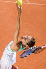 Young woman playing tennis © BGStock72