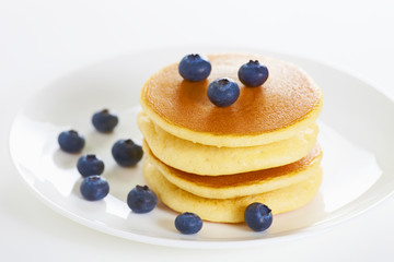 Pancake on white with blueberry