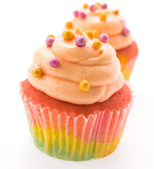 Colorful cupcakes isolated on white