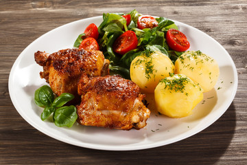 Grilled chicken legs with vegetables