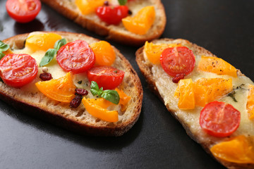 Tasty bruschetta with tomatoes in pan, close up