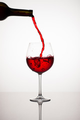 Fototapeta na wymiar Red Wine Glass with Bottle