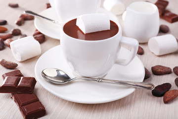 Cups of hot chocolate on table, close up