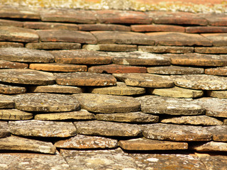 Old roof tiling texture, damaged and ruined.