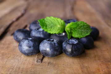 Blueberries on wooden background closeup