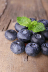 Blueberries on wooden background closeup