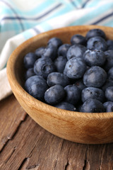 Wooden bowl of blueberries