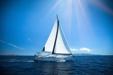 Yacht in the bright sunlight. Luxury yachts.