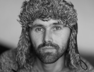 bearded man in a cap
