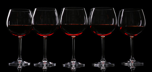 Glasses of wine isolated on black