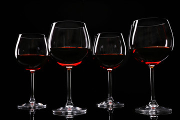 Glasses of wine isolated on black