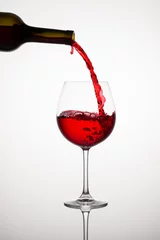 Fotobehang Red Wine Glass with Bottle © Itan1409