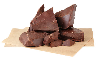 Cracked chocolate block on paper napkin isolated on white